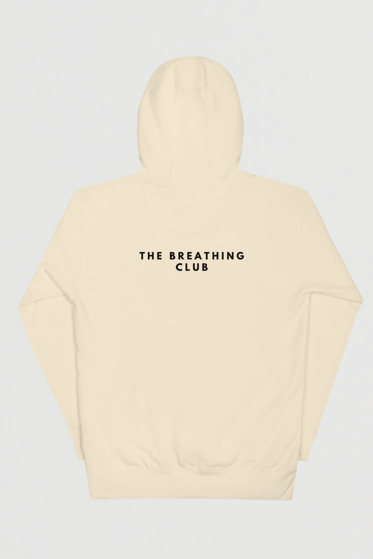 Beige hoodie with 'THE BREATHING CLUB' text on a light gray background. Unisex hoodie Men’s hoodie Women’s hoodie Beige hoodie with a bear graphic and 'Just Breathe' text. 100% cotton. Back image.
