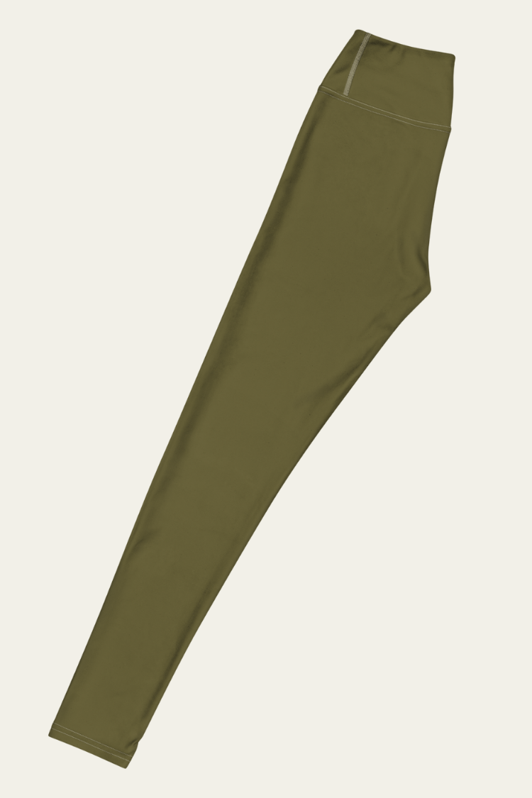 Green leggings on a beige background. Womens olive green leggings. VINYASA leggings Womens yogapants yoga leggings pilates leggings. Yoga folded image.