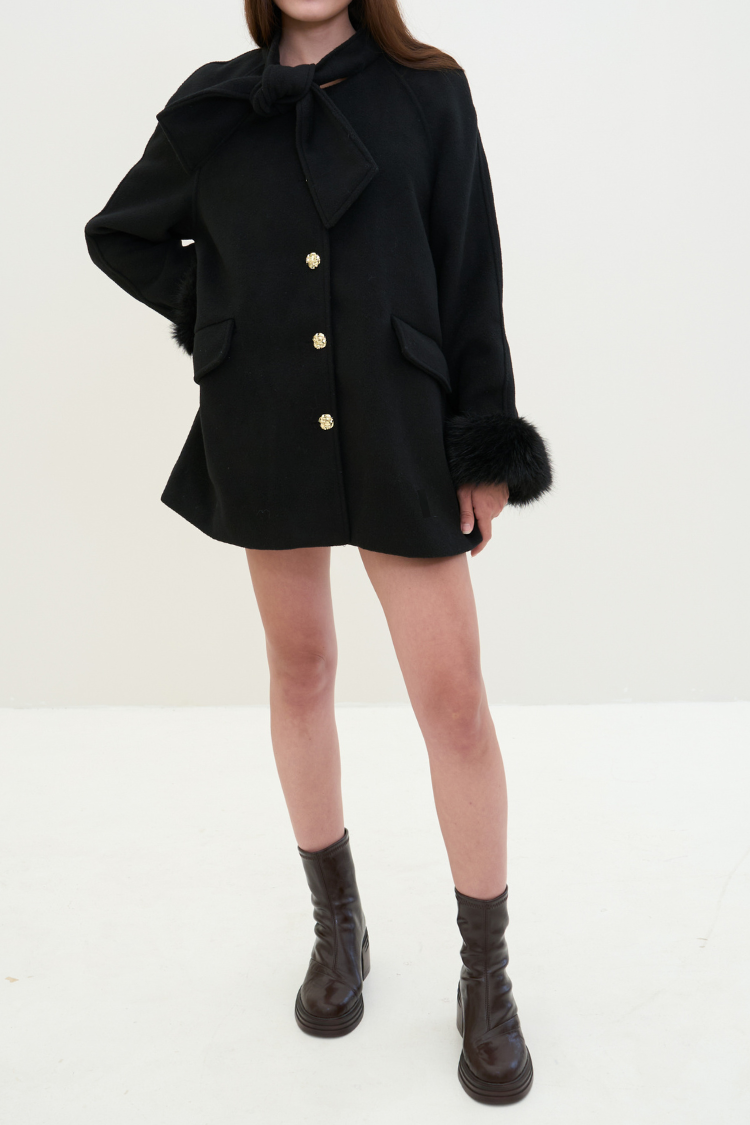 Pair of women's black leather ankle boots. Chelsea boots. Timberland boots. Brown shoes. Brown boots. Riding boots. styling front image.