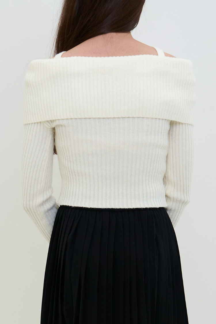 Women wearing a white off-shoulder sweater and black skirt against a plain background. CELINENA top back image. White ribbed sweater blouse with cut-out design 